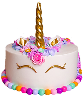 A cake decorated as a unicorn head with a gold horn, ears, and closed eyes. It has colorful flowers on top and a bead-like border at the base.