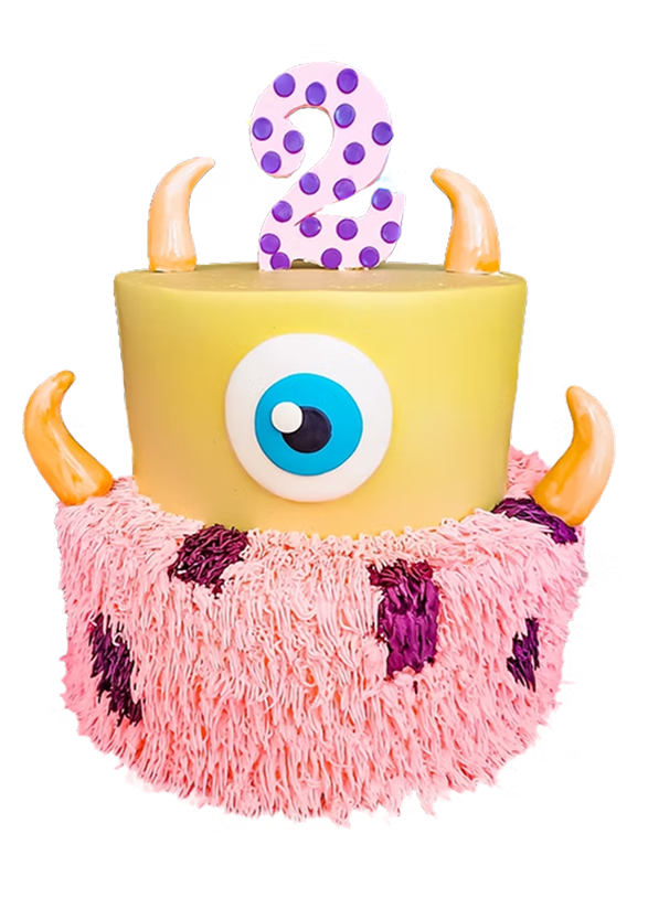 A two-tiered monster-themed cake with a large eye, yellow top, pink furry base, orange horns, and a purple polka-dotted number two on top.